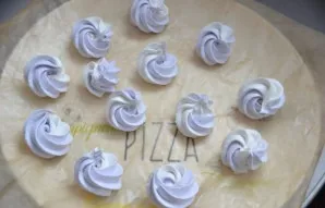 Put two small pastry bags in one large confectionery bag - one with white, the second with a colored (lavender) mass. On baking paper, sq...