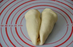 Wrap both edges towards the center so that two croissants come out.