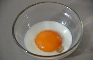 Mix one egg with a spoonful of milk or vegetable oil.