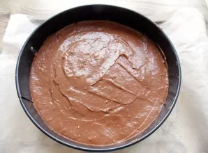 Line a tray or flat plate with baking paper. Put a ring from a removable form, without a bottom, install a biscuit. Transfer the chocolat...