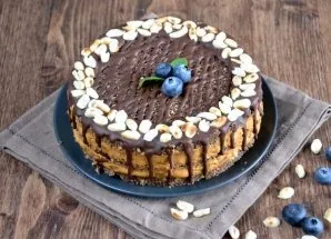 Remove the cake from the mold, make chocolate drops on the cake that will drip the edge down, apply a chocolate mesh on top, decorate wit...