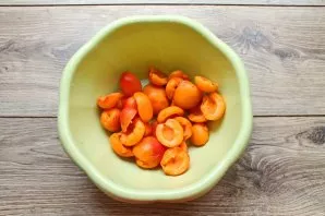 Apricots are sorted, washed, drained and dice removed.