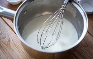 Pour the milk into a saucepan and heat over low heat to a temperature of 35-37 degrees. Then remove from the stove a saucepan with warm m...