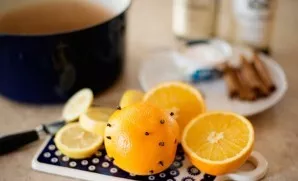 Dip the cloves into the orange as follows.