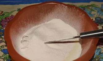 Add flour in portions. Flour is always different, so the quantity is different every time.