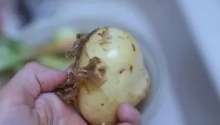Peel the potatoes.