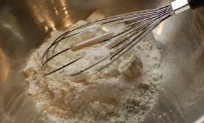 Sift the flour, mix with salt, baking powder, soda.