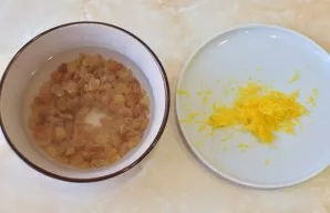 Raisins pour boiling water and let stand for 15 minutes to evaporate. Then rinse and dry on a towel. Rinse the lemon and pour boiling wat...