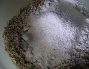 Put flour and baking powder on top. Mix everything.