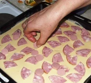 Next, lay out the filling. Sausage comes first for me.