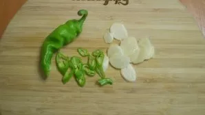 Finely chop the chilli and garlic.