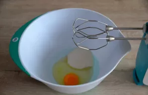 Beat the egg with sugar (or sweetener, honey).