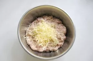 Add grated hard cheese to the mince.