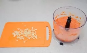 Pour the tomatoes with boiling water, remove the cuticle from them, cut into small pieces. Peel and chop the garlic, put in a blender alo...