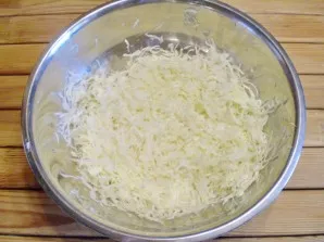 With a sharp knife or chopper, chop the cabbage.