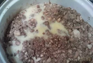 On the stove, melt the butter and cool slightly. Add condensed milk and cocoa to the cookies. Then add butter there and gently stir the m...