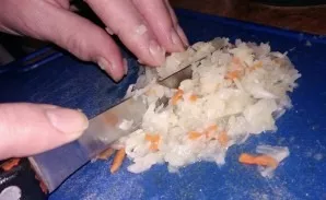 Cut the cabbage to make it tastier to eat later.