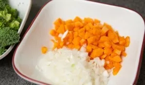 Peel and chop the onion and carrots.