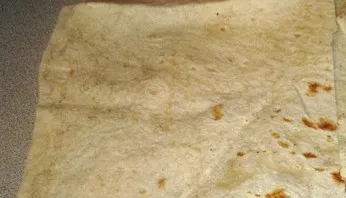 Cut each sheet of pita into long, wide strips.