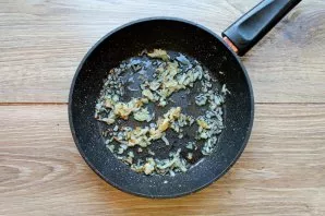 Peel the onion and chop finely. In a pan over medium heat, heat vegetable oil and fry the chopped onion for 5-7 minutes, stirring occasio...