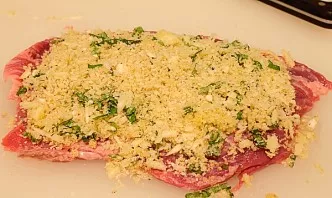 Spread the cheese mixture on a flat piece of meat.