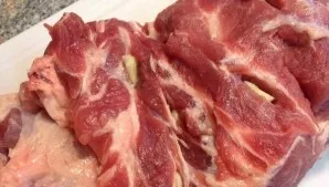 Wash a whole piece of pork and dry with paper towels. Wipe off excess fat and deeply stab with a thin sharp knife. Put garlic cloves in t...