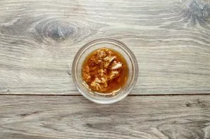 Mix vegetable oil, mustard, salt, adjika, pepper and crushed garlic.