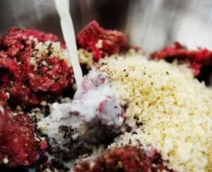 Add finely chopped garlic clove, salt, pepper and milk.