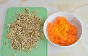 Grate carrots on a medium grater. Remove the orange peel. Chop the walnuts with a knife, but do not grind it too much. Due to the taste, ...