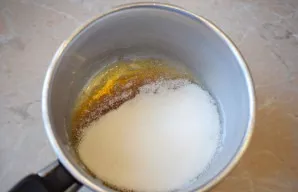 Pour sugar into the pot in a thin layer and put on a small fire. No need to mix sugar. Wait until the sugar dissolves on its own. Then sh...