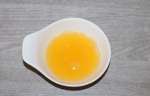 Squeeze the juice from the orange.