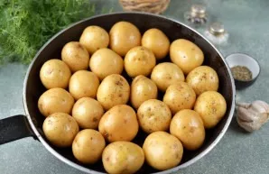 Transfer the potatoes to a large baking pan; they should be in one layer. If you have a pan with an iron handle, it is perfect for this d...