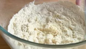 Sift flour with baking powder, add and knead to a soft, elastic dough.