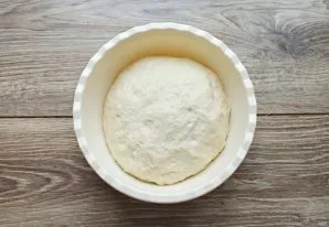 Prepare a soft yeast dough. To do this, mix warm water, fresh yeast, egg and vegetable oil until smooth. Half of the flour is mixed with ...