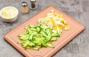 Wash and dry fresh cucumber, then cut the cucumber into small strips. Boil the egg for 10-12 minutes. After that, cool the egg, peel it a...