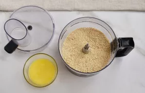 Crush the cookies, you can use a food processor.