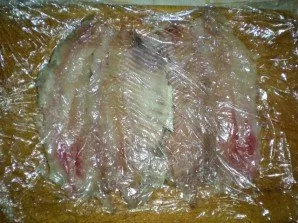 Cover the fillet with another piece of cling film and gently line the fillet with a hammer, removing all thick stains. It is important no...