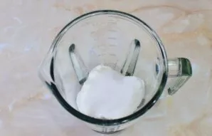 Put the cottage cheese in a blender bowl. Add sugar.