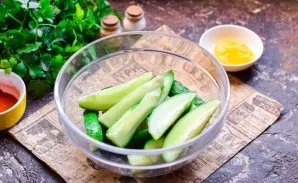 Wash and dry the cucumbers. To make cucumbers crispier, you can pre-pour them with cold water and leave for an hour. Cut the cucumbers in...