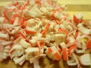 Meanwhile, you can finely chop the crab sticks. You can also use other seafood  for example, boiled shrimp or squid.