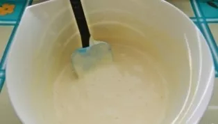 Mix flour, starch and baking powder. Sift the dry mixture into eggs whipped with sugar. Mix with a spatula.