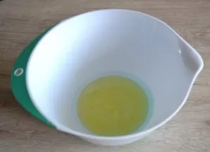 Pour the egg whites into a bowl, add a pinch of salt and beat until soft peaks are formed.