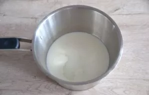 Pour kefir (or yogurt) and water into a saucepan, heat slightly.