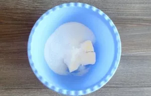 Mix sugar and butter in a bowl. Mash with a fork.