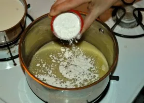 Add flour to the fully melted butter in several stages, mixing well.