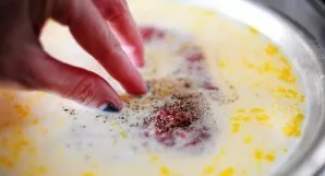 Take one piece of meat, season with salt and pepper on both sides, then dip in a milk-egg mixture. Then put the meat on a plate with flou...