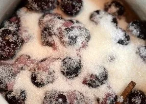 Add sugar and let stand a little until the cherries release the juice.