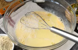 Pour milk and butter, continue to beat.