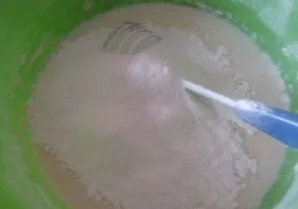 Now add the flour in small portions and stir so that there are no lumps. Let the dough rest for 15 minutes.