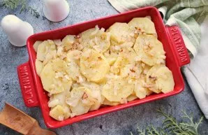 Finely chop the onion and fry in a pan with vegetable oil, stirring for 5 minutes. Grease the baking sheet with vegetable oil and lay out...